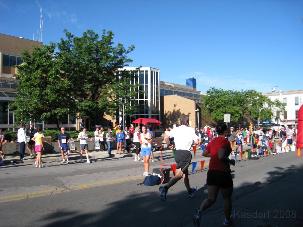 Tortoise_Hare_5K_08 180.jpg - . . . . and there he goes for the final time heading to the finish line and the timing mats.